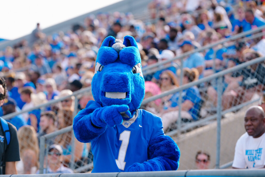 MTSU mascot Lightning looking at the camera and pointing.